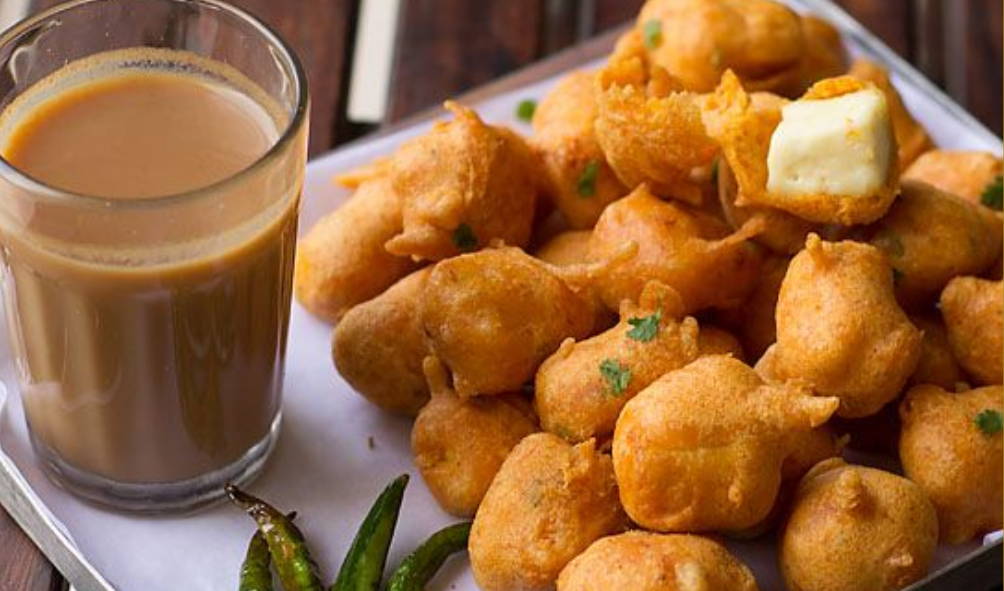  chai with a plate full of fritters