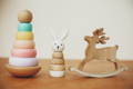 Cute wooden stacking Montessori toys on display. 