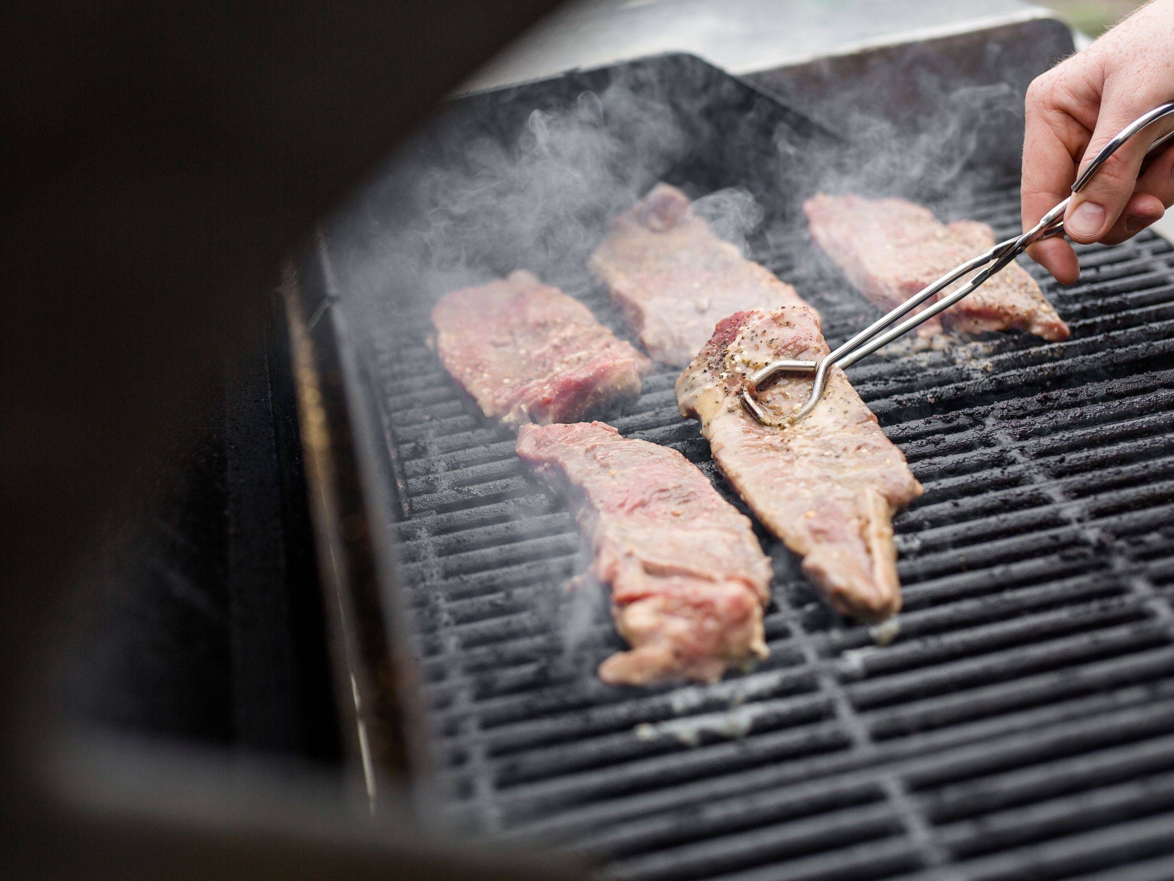 steaks on a grill