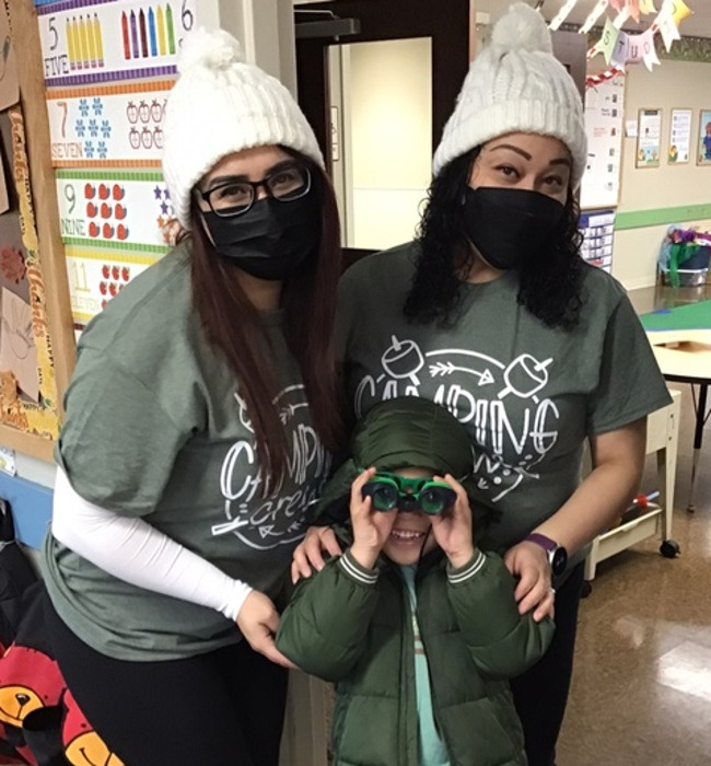 teachers and students dressed up in camping gear