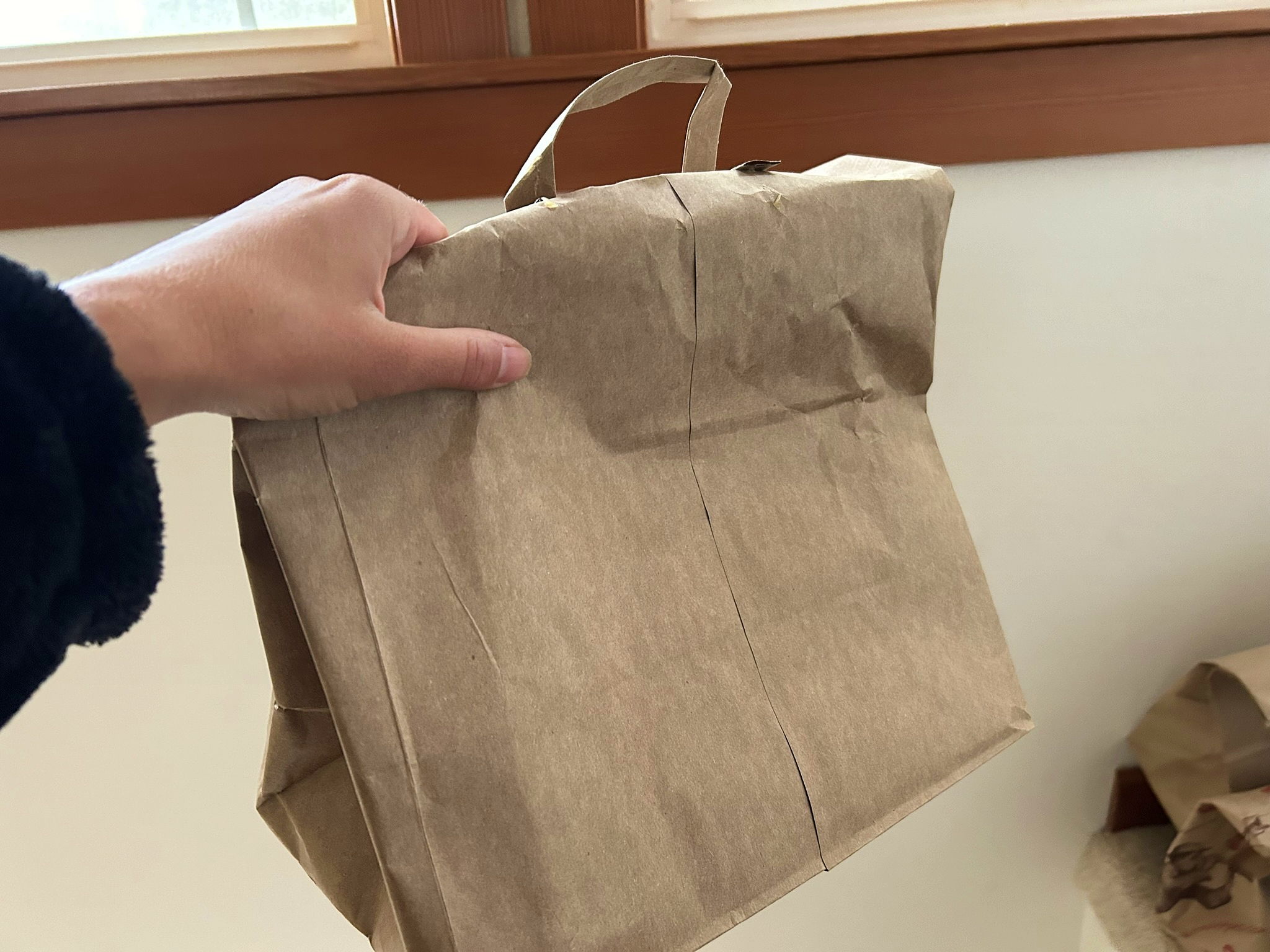 A paper bag full of drying herbs